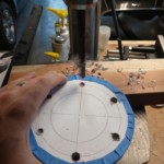 After all the holes were started, they were drilled through.