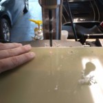 Drilling the holes in the fins.
