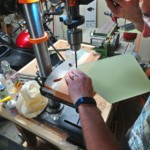 Drilling the holes on the fins.