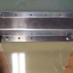 The resulting marks on the fins from the transfer punch.