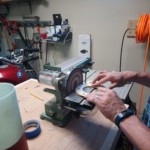 Shaping the centering ring with the disk sander.