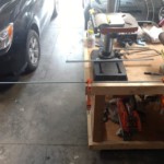 The threaded rod is clamped to the workbench to hold it in place while cutting.